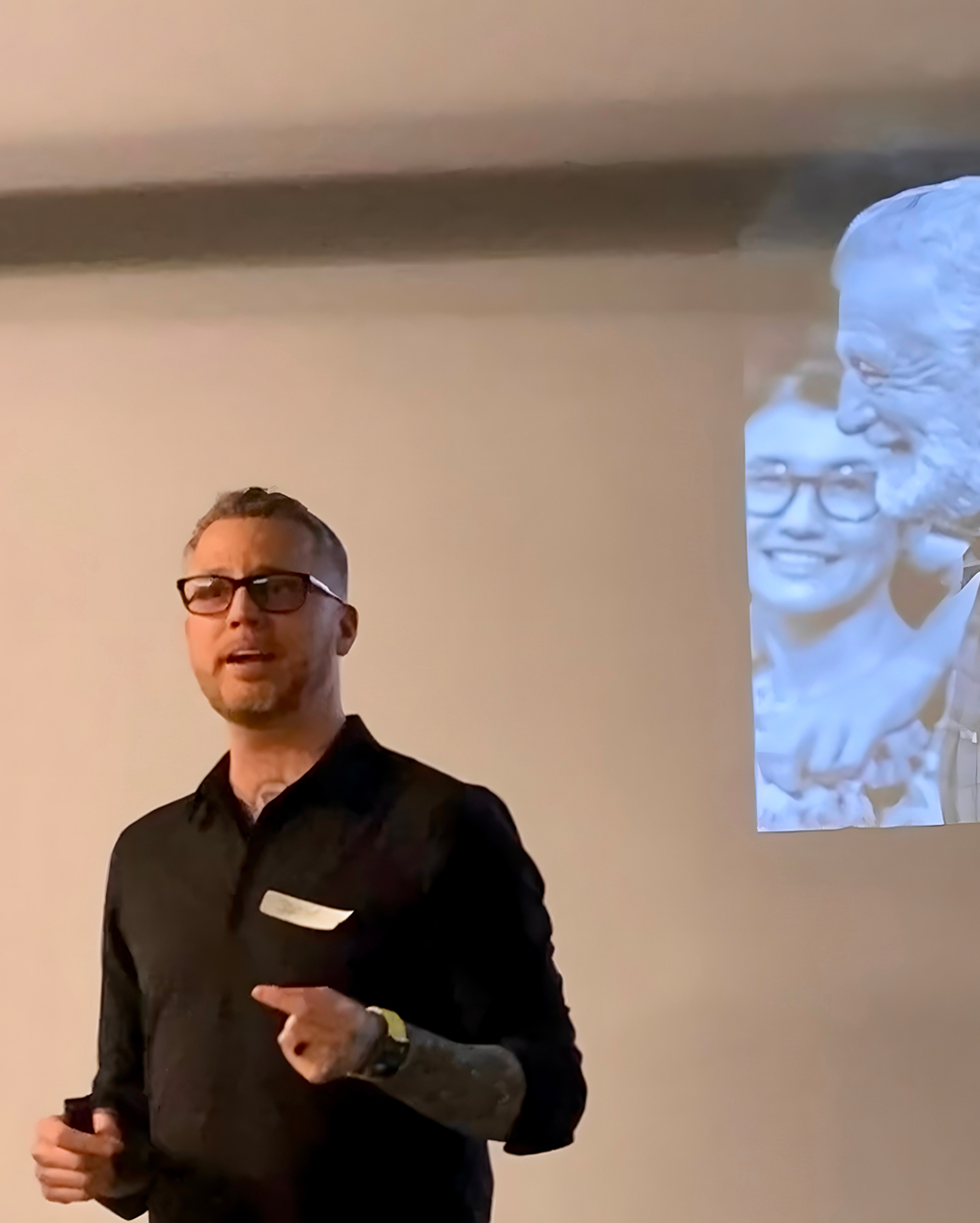 Jamie Gerrard speaking at a presentation.